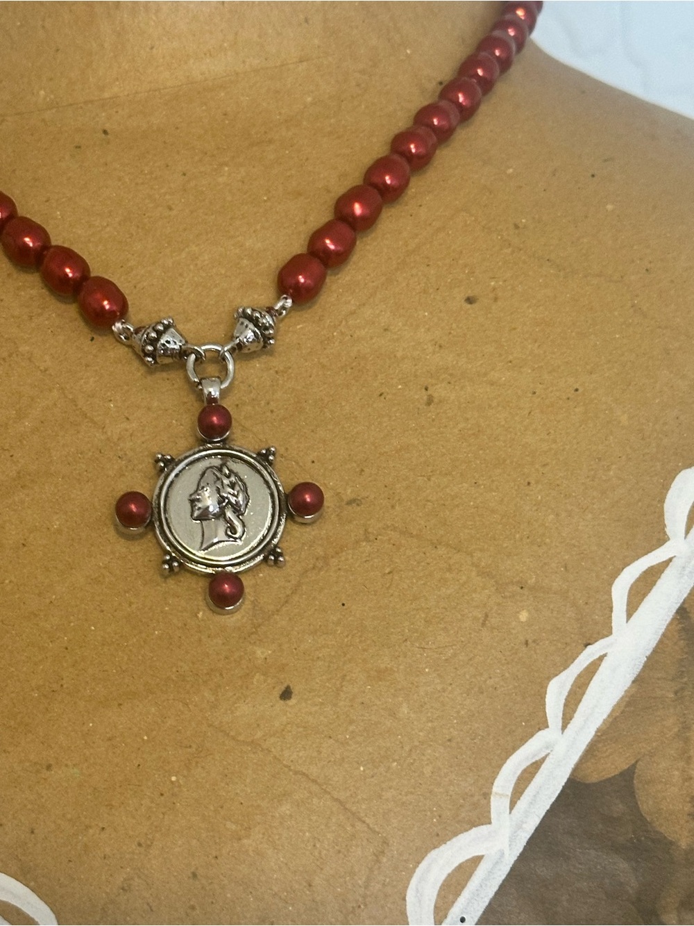 Unlisted Red Beaded Necklace with Silver Profile Medallion